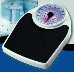 Scales - Bathroom Capacity 330 Lbs Extra large platform * Spring load technology * Over-sized dial display * Non-slip mat * Capacity: 330 lbs * Colors: White Frame with Black Mat* 13.375
